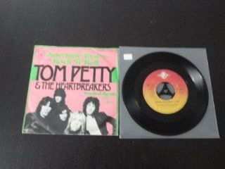 anything thats rock n roll / fooled again (i don't like it) 45 rpm single: Music
